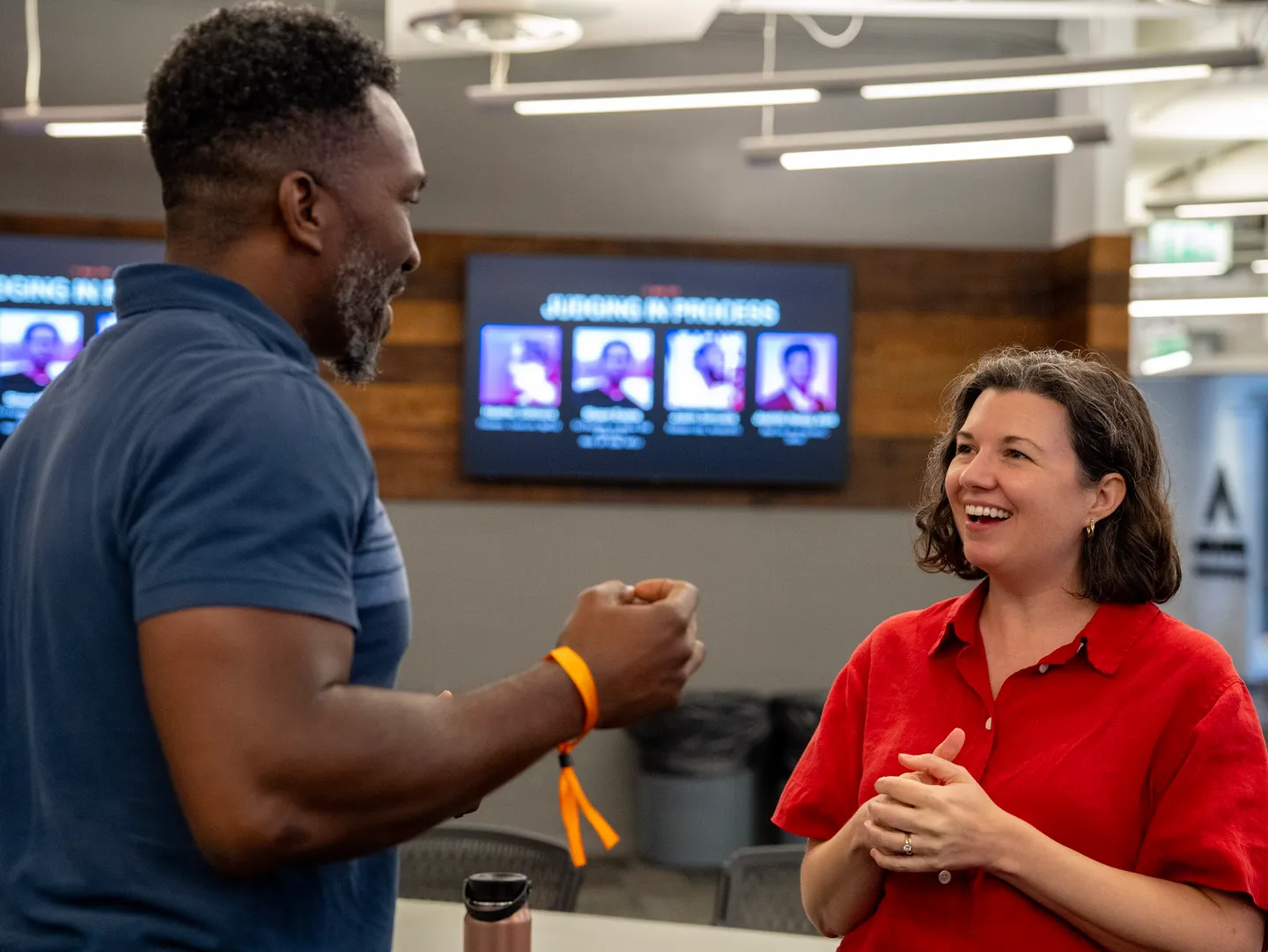 Two hackathon attendees chatting on day two