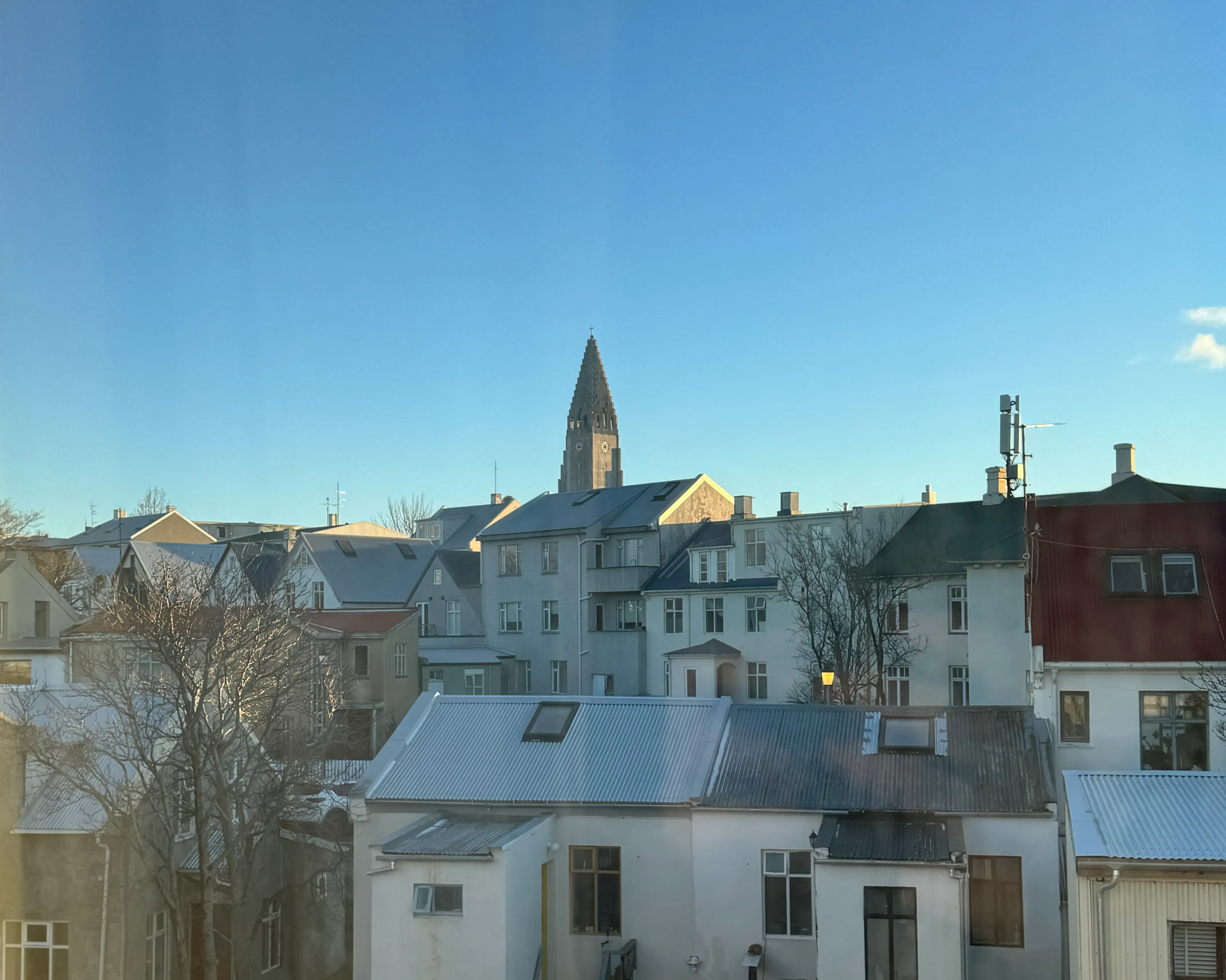 A quiet neighborhood with a church towering over it