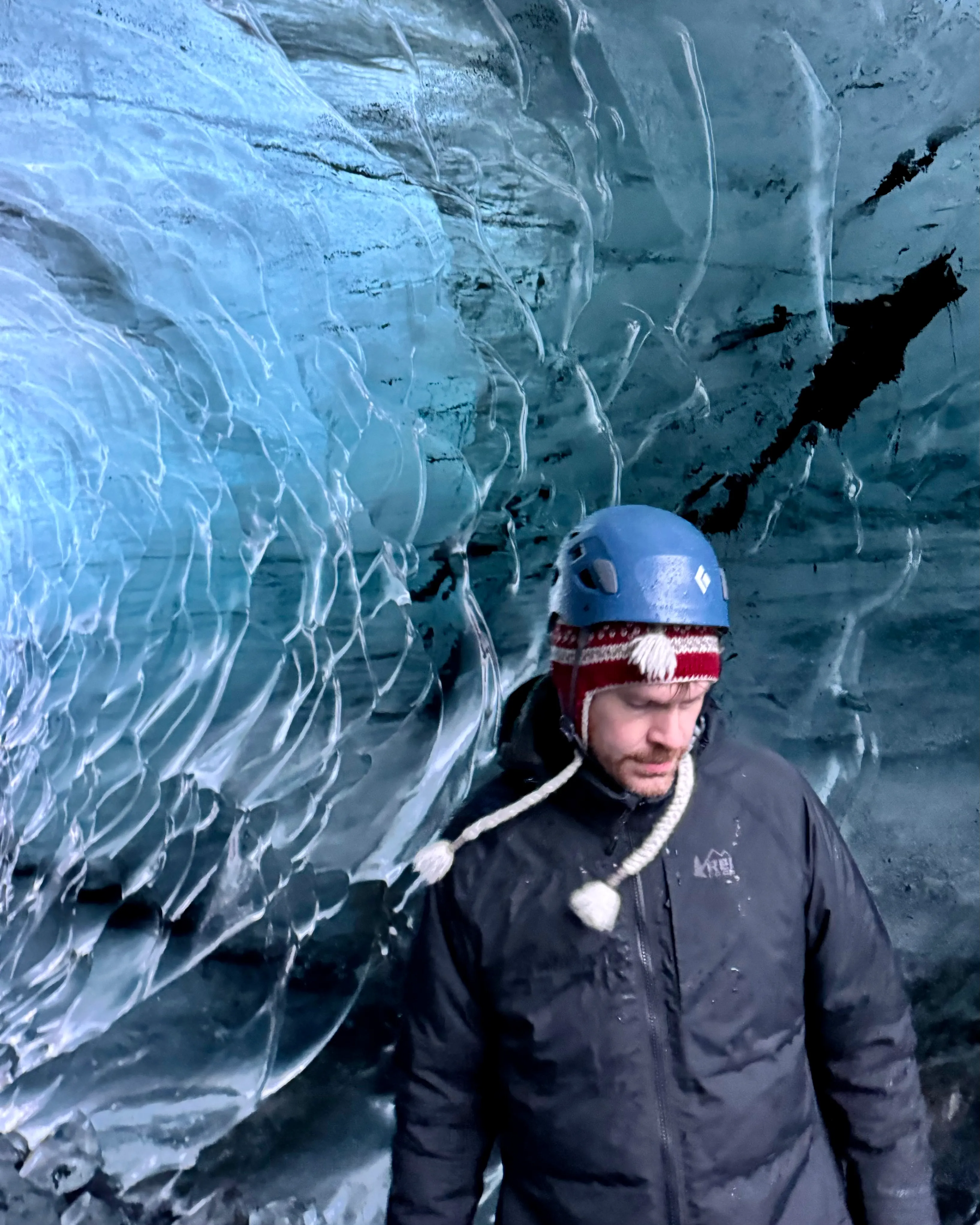 Alan wearing a helmut in an ice cave