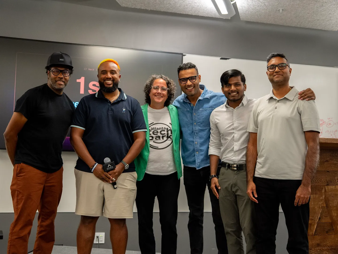 The hackathon winners and judges together after the competition